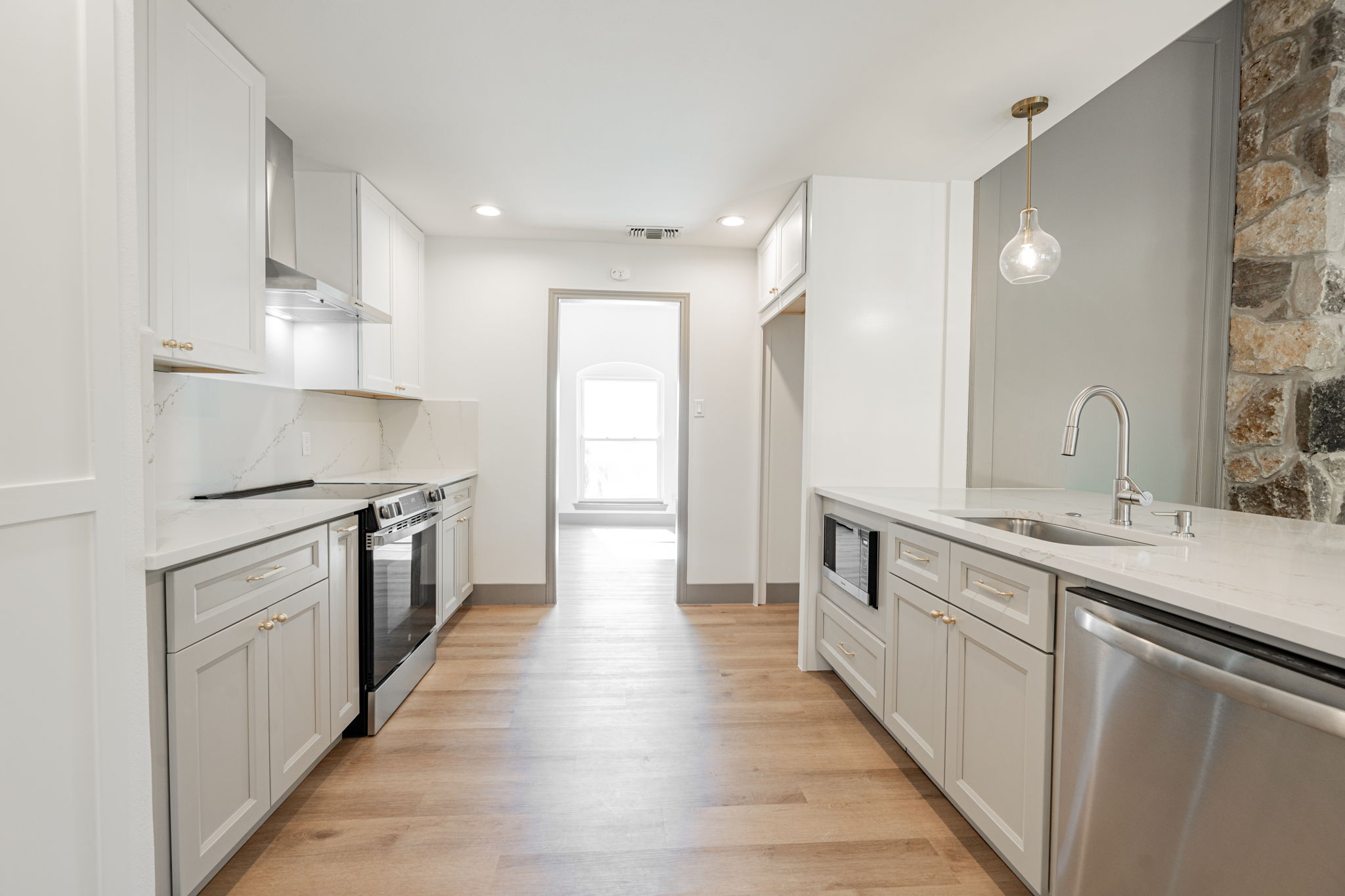 Renovated kitchen with island and modern finishes